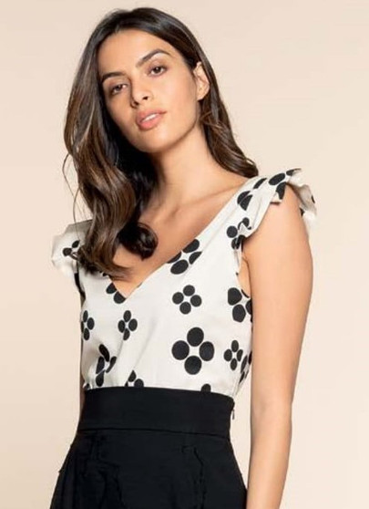 Made In Italy, gorgeous sleeveless cream top with soft black flower print. 97% Cotton, 3% Elastin, 97% Polyester. This top is so elegant and can be worn with Hanita long skirt or with elegant pants.  