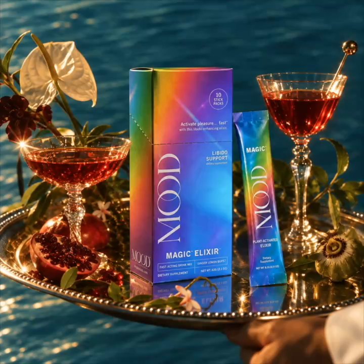 Rainbow MOOD box beside a ruby drink, ginger and lemon