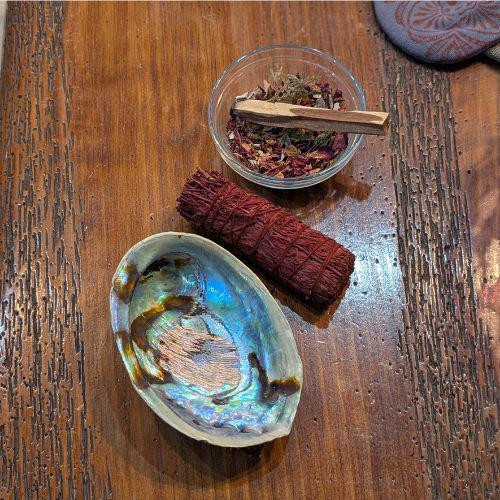 4-inch Abalone Shell with shimmering interior displayed on a wooden table at Prana Blessings Metaphysical Shop in Santa Fe — natural shell for sage, smudging, and energy cleansing rituals. 4-inch Abalone Shell with shimmering interior displayed on a wooden table at Prana Blessings Metaphysical Shop in Santa Fe — natural shell for sage, smudging, and energy cleansing rituals.