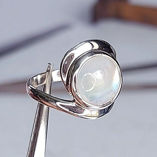 Sterling silver Endless Life ring with rainbow moonstone, handcrafted by Crystal Earth Studios, size 9 artisan jewelry. Sterling silver Endless Life ring with rainbow moonstone, handcrafted by Crystal Earth Studios, size 9 artisan jewelry.