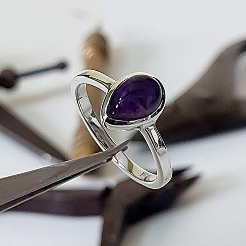 Sterling silver tear-shaped amethyst Stone Power ring handcrafted by Crystal Earth Studios, artisan gemstone jewelry. Sterling silver tear-shaped amethyst Stone Power ring handcrafted by Crystal Earth Studios, artisan gemstone jewelry.