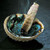 An abalone shell with burning sage stick. An abalone shell with burning sage stick.
