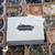 Protection Mystery Box with black brushstroke label and Zia sun symbol, intuitively curated for grounding, cleansing, and energetic protection. Protection Mystery Box with black brushstroke label and Zia sun symbol, intuitively curated for grounding, cleansing, and energetic protection.