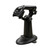 Cino F560 barcode scanner resting in its black hands free stand on a counter