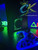 Custom Xbox 360 Slim RGH3 featuring bright green LEDs and a clean black finish. Learn more at ConsoleKings360.com.