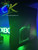 Xbox 360 Slim RGH3 in black with custom green LED upgrades. Available from ConsoleKings360.com.