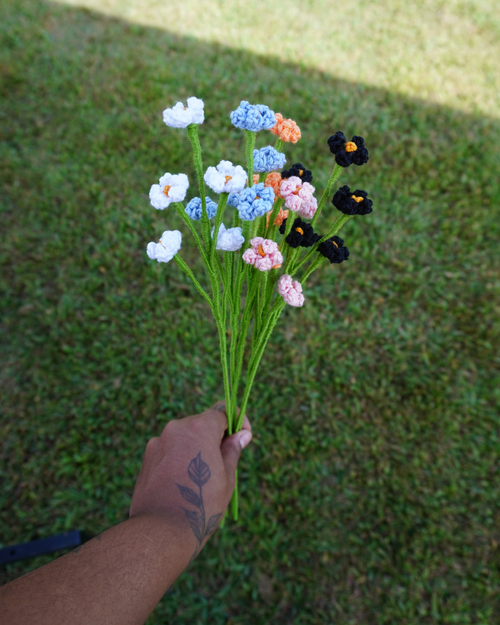 A handmade crochet bouquet in all the colors available for the Baby's breath