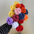 Close up of a batch of multicolored mini crochet roses