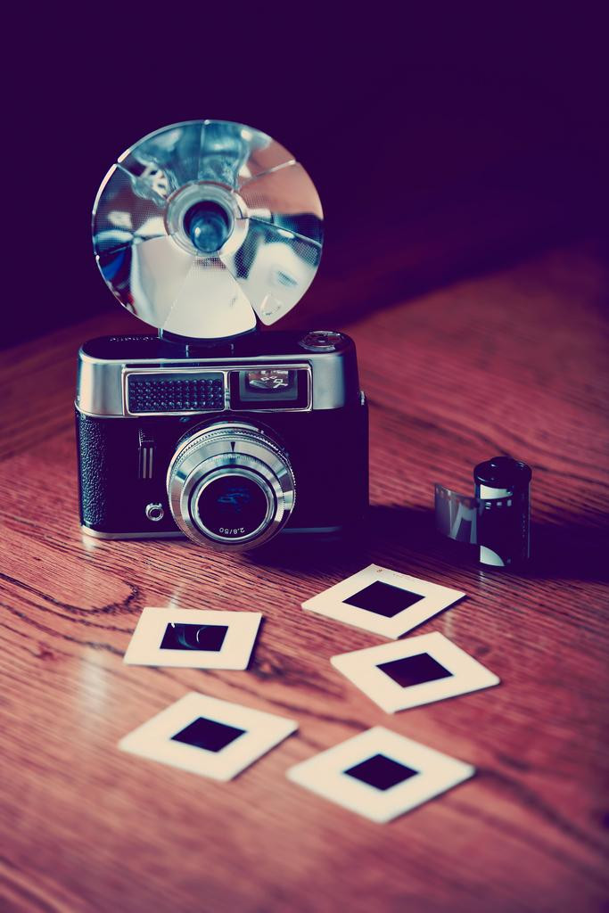Laminated Old Fashioned Camera with Flash Film and Slides Photo