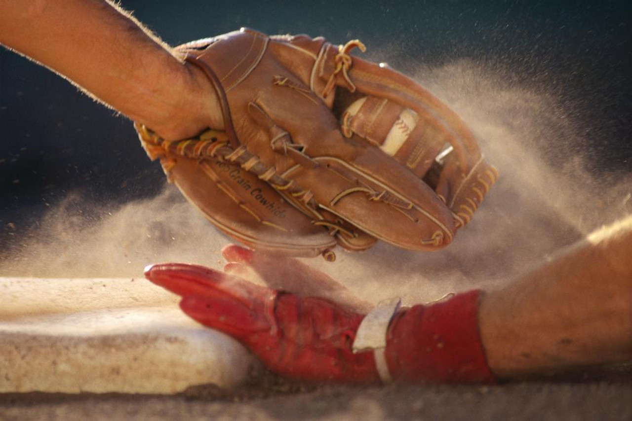 Baseball Player Sliding Into Base Being Tagged Out Close Up Photo