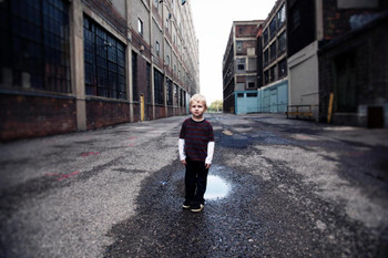 Laminated Young Boy Standing in Urban Alley Photo Photograph Poster Dry Erase Sign 36x24