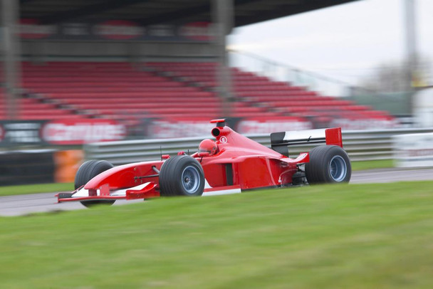 Laminated Red Formula One Car on a Racing Track Photo Art Print Poster Dry Erase Sign 36x24