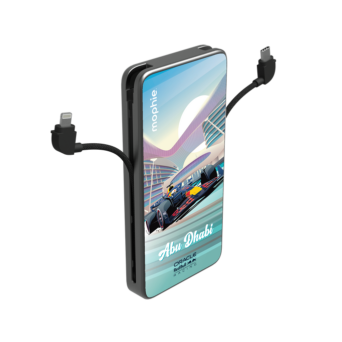 A sleek black Powerstation Plus 10K resting on a leather notebook next to a cup of Arabic coffee, with its integrated USB-C cable charging a gold iPhone.