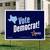 A yard sign which reads, "Vote Democrat!" with the outline of the state of Texas on the left.