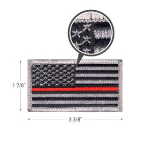 Thin red line detail on embroidered American flag patch Thin red line detail on embroidered American flag patch