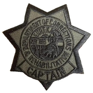 Close-up of embossed detailing on subdued Captain Star badge Close-up of embossed detailing on subdued Captain Star badge