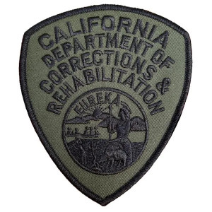Close-up of subdued CDCR emblem embroidery details Close-up of subdued CDCR emblem embroidery details