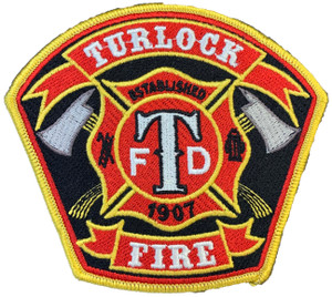 Close-up of embroidered Turlock Fire Department emblem details