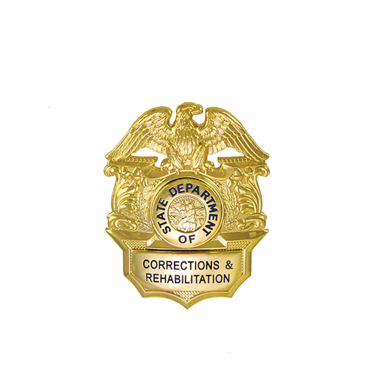 Gold-plated CDCR badge close-up view