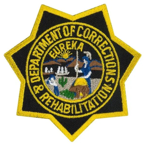 Close-up of engraved CDCR lettering and star detailing