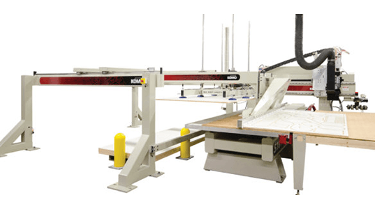 automatica material handling system that is adjacent to the CNC table.