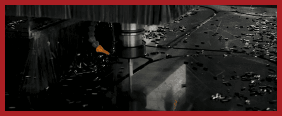 Plastic material shapes being cut with router bit