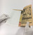 MicroChamber Interleaving Archival Paper Modern Size being inserted into a comic book.