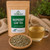 Organic Raspberry Leaf Tea in The Tea Hut certified organic kraft pouch, with loose raspberry leaves beside a pale golden brewed cup.