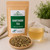 Organic Hawthorn Tea in The Tea Hut certified organic kraft pouch, with loose hawthorn leaves and flowers beside a pale golden brewed cup.
