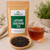 Lapsang Souchong Tea in The Tea Hut kraft pouch, with loose dark smoked Lapsang Souchong leaves beside a deep reddish-amber brewed cup.