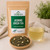 Organic Jasmine Green Tea in The Tea Hut certified organic kraft pouch, with loose Mao Feng green tea and jasmine blossoms beside a light yellow-green brewed cup.