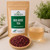 Organic Red Rose Tea in The Tea Hut certified organic kraft pouch, with loose red rose petals beside a pale golden brewed cup.
