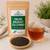Bulk English Breakfast Tea (Strong) in The Tea Hut certified organic kraft pouch, with loose fine-cut English Breakfast black tea beside a deep rich amber brewed cup.