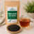 Organic Vanilla Black Tea (Decaf) in The Tea Hut certified organic kraft pouch, with loose decaf vanilla black tea beside a rich amber brewed cup.