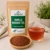 Bulk Vanilla Rooibos Tea in The Tea Hut certified organic kraft pouch, with loose vanilla rooibos tea beside a deep copper-red brewed cup.