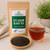 Bulk CTC Assam Black Tea in The Tea Hut certified organic kraft pouch, with loose CTC Assam tea pellets beside a deep amber brewed cup.