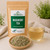 Bulk Mugwort Tea in The Tea Hut certified organic kraft pouch, with loose mugwort leaves beside a pale golden brewed cup.