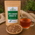 Bulk Apple Cinnamon Rooibos Tea in The Tea Hut certified organic kraft pouch, with green rooibos, cassia cinnamon and apple pieces beside a brewed cup.