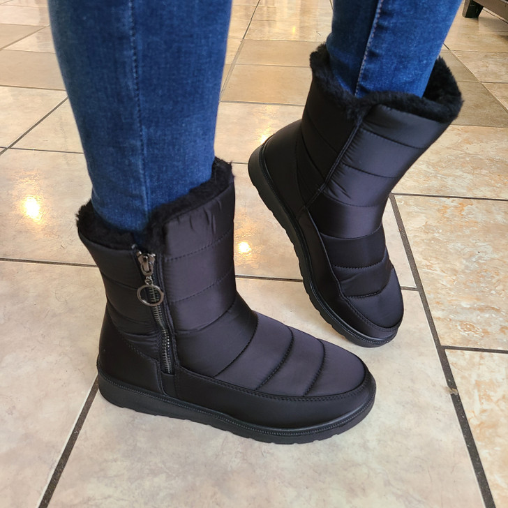 A pair of cozy, winter boots with a modern design,mid-calf height with zippers on their outer sides for easy wear, quilted detailing and plush interior for warmth and style