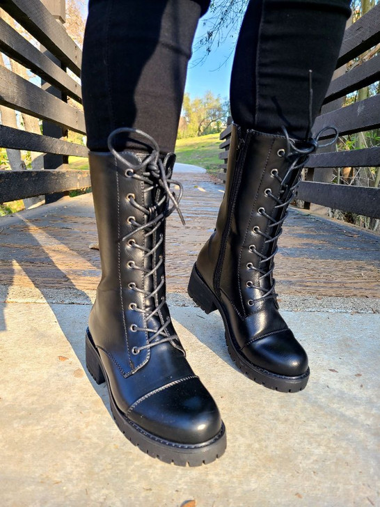 Step into style with these sleek black lace-up mid-calf combat boots, perfect for a casual yet edgy look. Crafted for comfort and style, they’re your go-to choice for any outfit