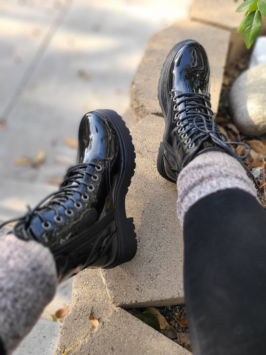 Experience the fusion of urban style and natural beauty with these glossy black combat boots.These boots are durable, comfortable, and fashionable. Whether you’re going for a casual, edgy, or chic look, these boots will add some flair to your style. Shop now!