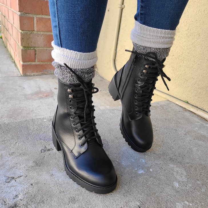 Step into comfort and style with these Black lace-up combat boots. Ideal for any season, these boots combine functionality and fashion. Shop now!