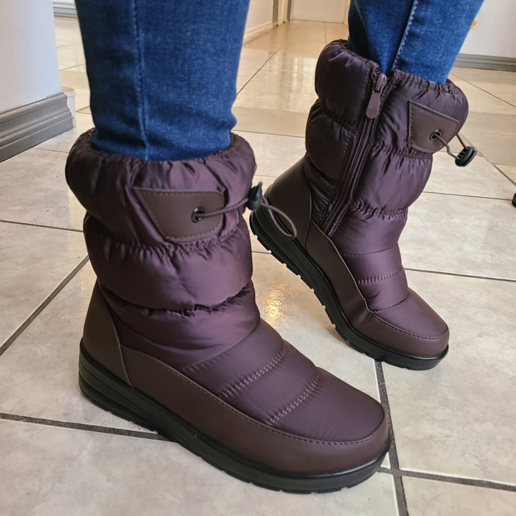 Step into Comfort and Style with these Brown Quilted Winter Boots. The boots feature a comfortable fit and are designed to keep feet warm and dry during the cold season. Shop now and get free shipping on orders over $100