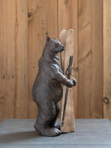 Bear holding Skis Figurine