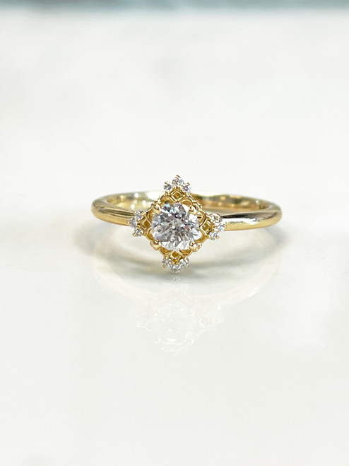 crown diamond engagement ring set in yellow gold and natural diamonds