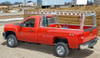 System One GMSC6 heavy-duty rack system on red Chevy truck with 6' bed and standard cab.
