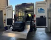 Liftgator VanGator Hitch-Mounted Liftgate in use with a van, showcasing equipment installation and functionality.