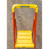 Werner PD6203-4C Series podium ladder with casters, yellow and orange color, 300 lb rated capacity.