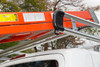 Prime Design AR1910 Ladder Rack for Ford Transit, 130" WB Mid-Roof, silver and orange color.
