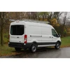 Topper #258144 12ft Van Rack with 60in Crossbars on white Ford Transit Van.